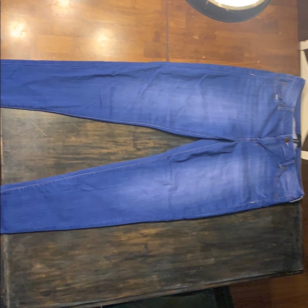 Blue skinny jeans that are a size 13/31.